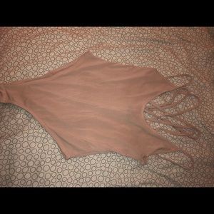 Soft pink body suit